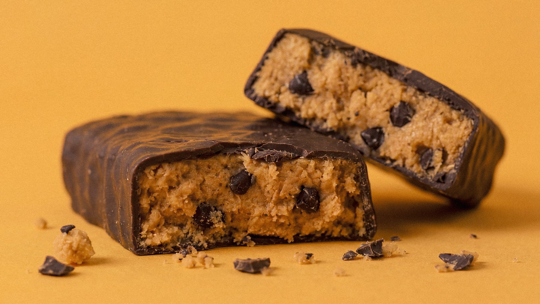Mighty Bar cut open, showing the soft peanut butter centre with dark chocolate pieces